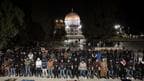 Muslim worshippers perform "tarawih," an extra lengthy prayer held during the Muslim holy month of Ramadan, next to the Dome of Rock at the Al-Aqsa Mosque compound in the Old City of Jerusalem