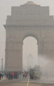 View of the India Gate covered in a dense layer of fog in New Delhi.
