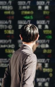 Japan's Nikkei ends lower on caution ahead of US inflation data