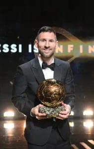 Lionel Messi poses with Ballon d'Or