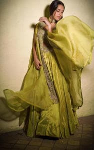 The actress wore a green lehenga-choli set paired with matching dupatta featuring golden border.